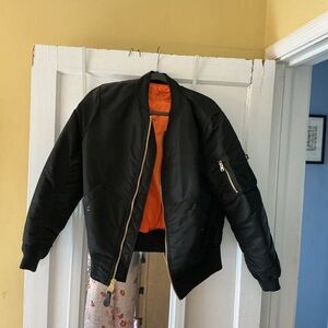 Alpha Industries MA-1 W Bomber Jacket - Black with iconic orange lining.